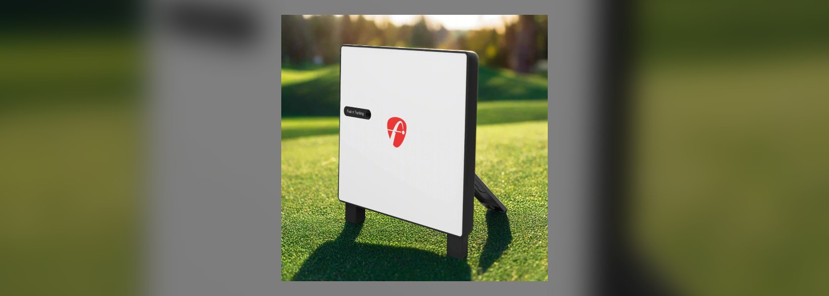 FlightScope X3C radar launch monitor set up outdoors on a golf course