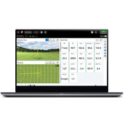 Laptop displaying a golf simulation software on a white background