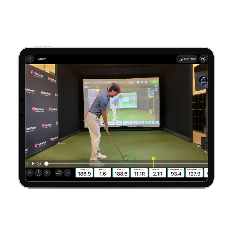 Golf simulator screen displaying a person practicing golf swings with various metrics from the Mevo Gen2 Launch Monitor