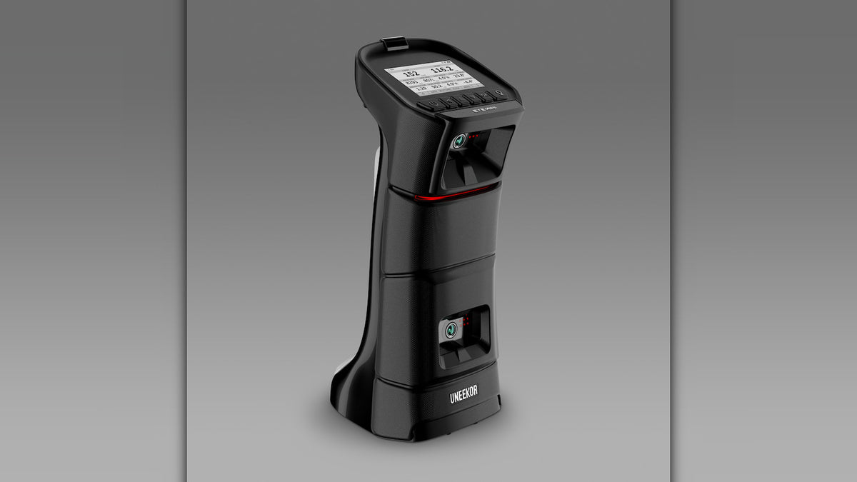 Angled three quarter view product photo of the Uneekor Eye Mini launch monitor on a gray background