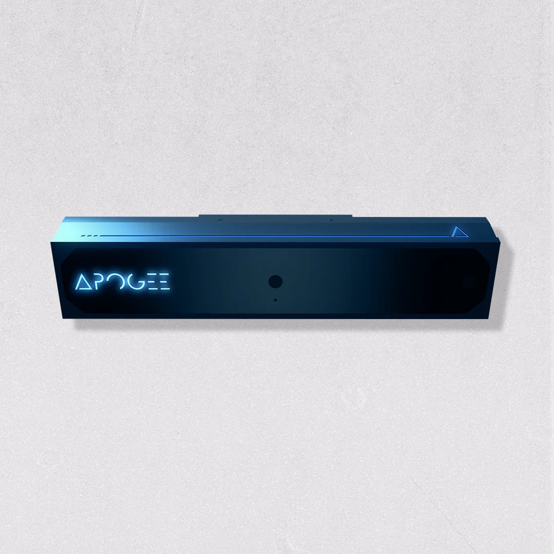 Front view of the TruGolf APOGEE launch monitor unit, a dark rectangular device with APOGEE branding and a sensor lens, on a light gray background
