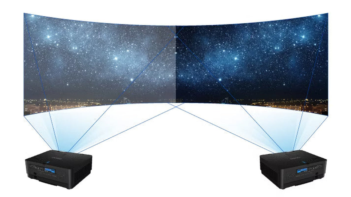 Two BenQ LU960ST2 projectors displaying a blended starry night sky and city skyline image across a large curved dual screen, showcasing dark scene and edge blending performance