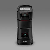 Uneekor EYE MINI launch monitor front view with built in display showing shot data