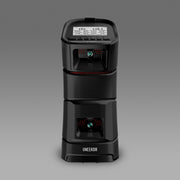 Uneekor EYE MINI launch monitor front view with built in display showing shot data